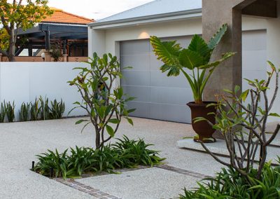 Exposed aggregate features in driveway